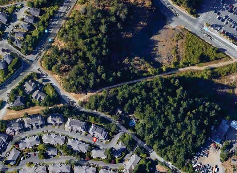 Aerial context map with the property boundary outlined in green