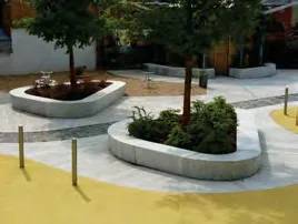 Photo of raised planters with integrated wood bench seating