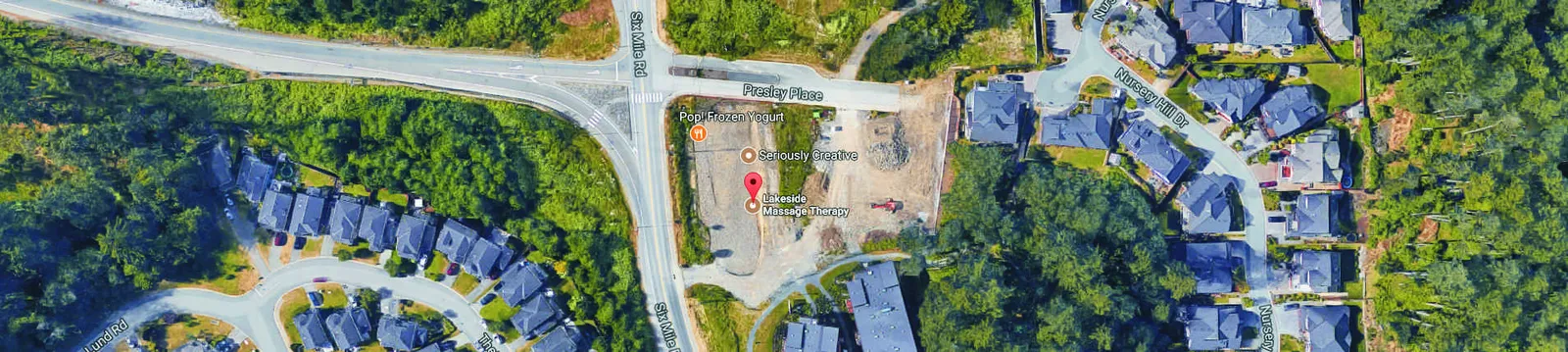 Satellite map marking business locations including Lakeside Massage Therapy, Seriously Creative, and Pop! Frozen Yogurt near the intersection of Six Mile Rd and Presley Place.