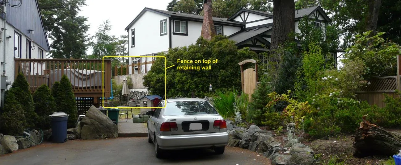Fence on top of retaining wall