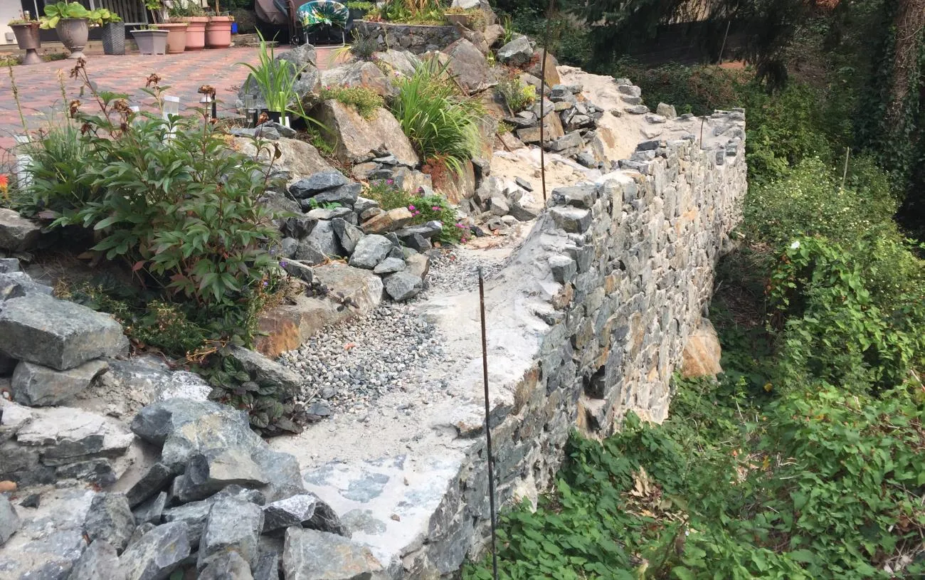 Photo of the partially finished retaining wall under construction