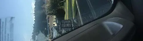Close-up view of the dashboard and the traffic line ahead.
