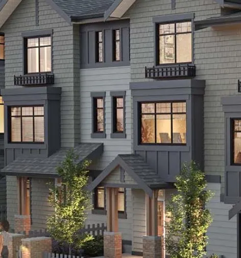 Rendering of a row of gabled townhouses with white picket fences