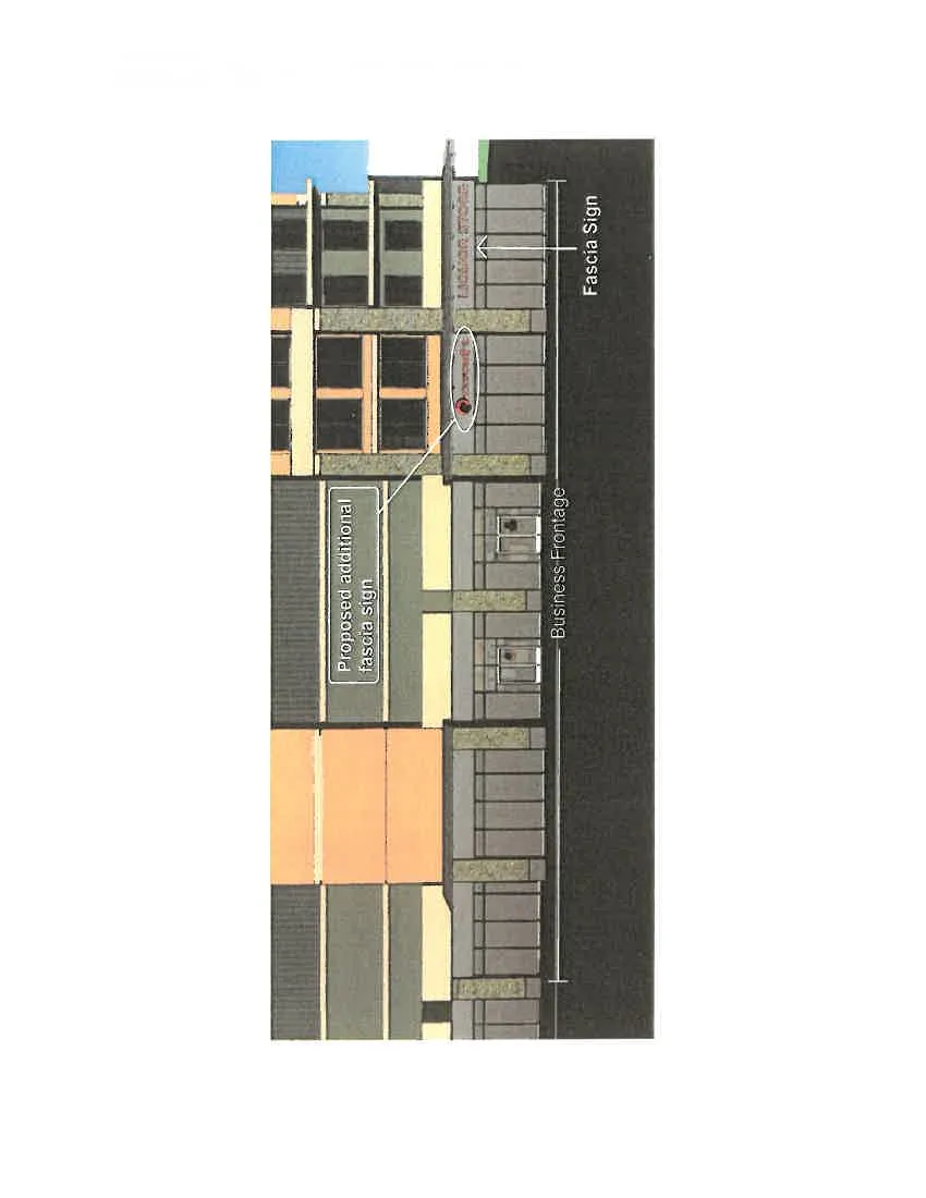 Rendering of the building facade showing the business frontage, an existing fascia sign, and the location for a proposed additional fascia sign
