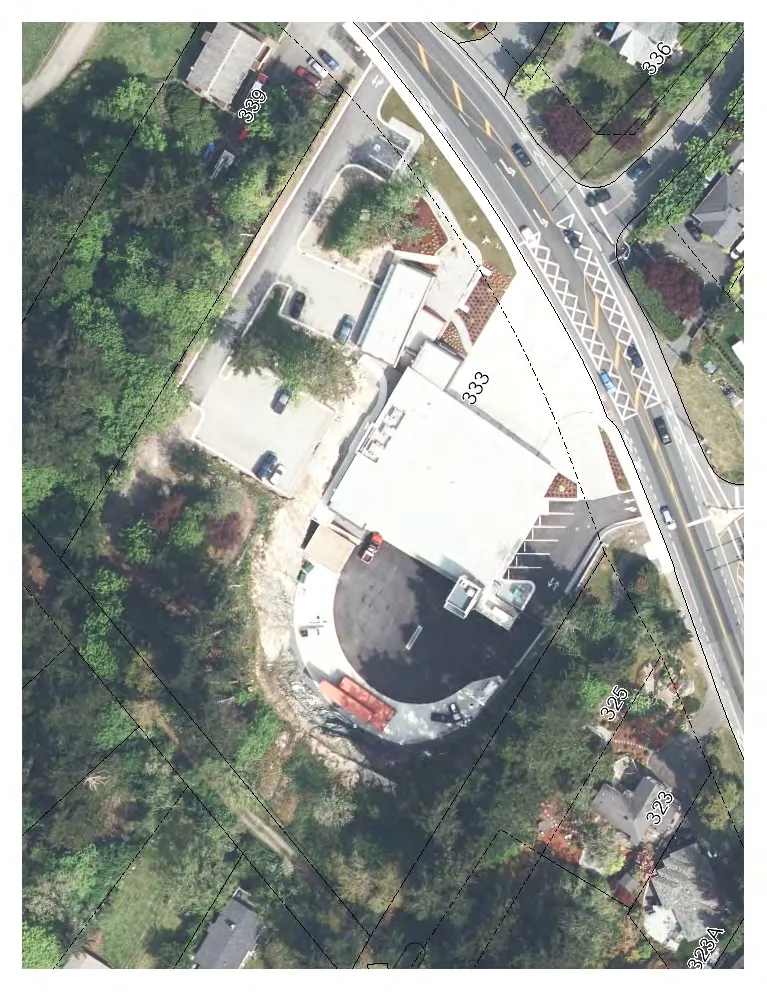 Aerial view map showing property 333 and surrounding parcels (339, 336, 325, 323, and 323A) with a proposed sign location indicated near the roadway.