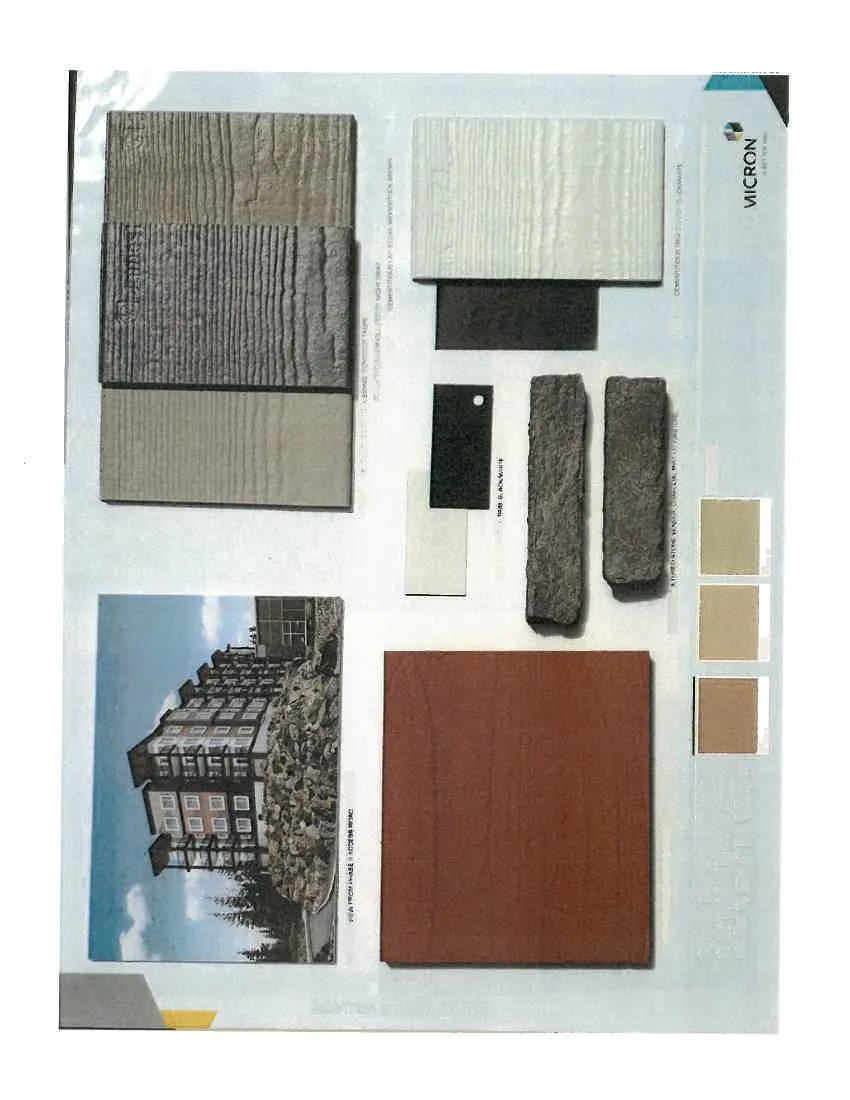 Material sample board for Eagle Creek Village Phase II featuring an architectural rendering of the building, various siding samples in grey, beige, and white, dark grey stone veneer samples, earth-toned paint swatches, and a large reddish-brown panel.