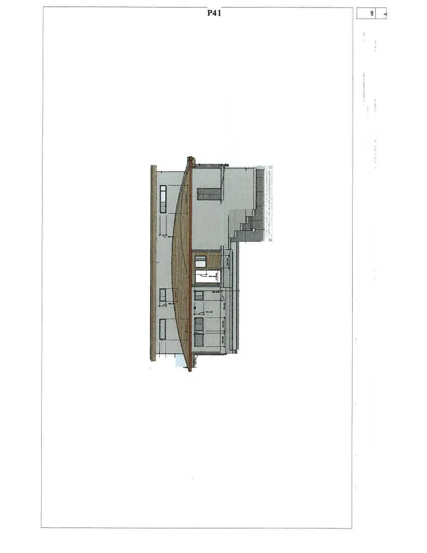Detailed view of the building's north facade and carport area